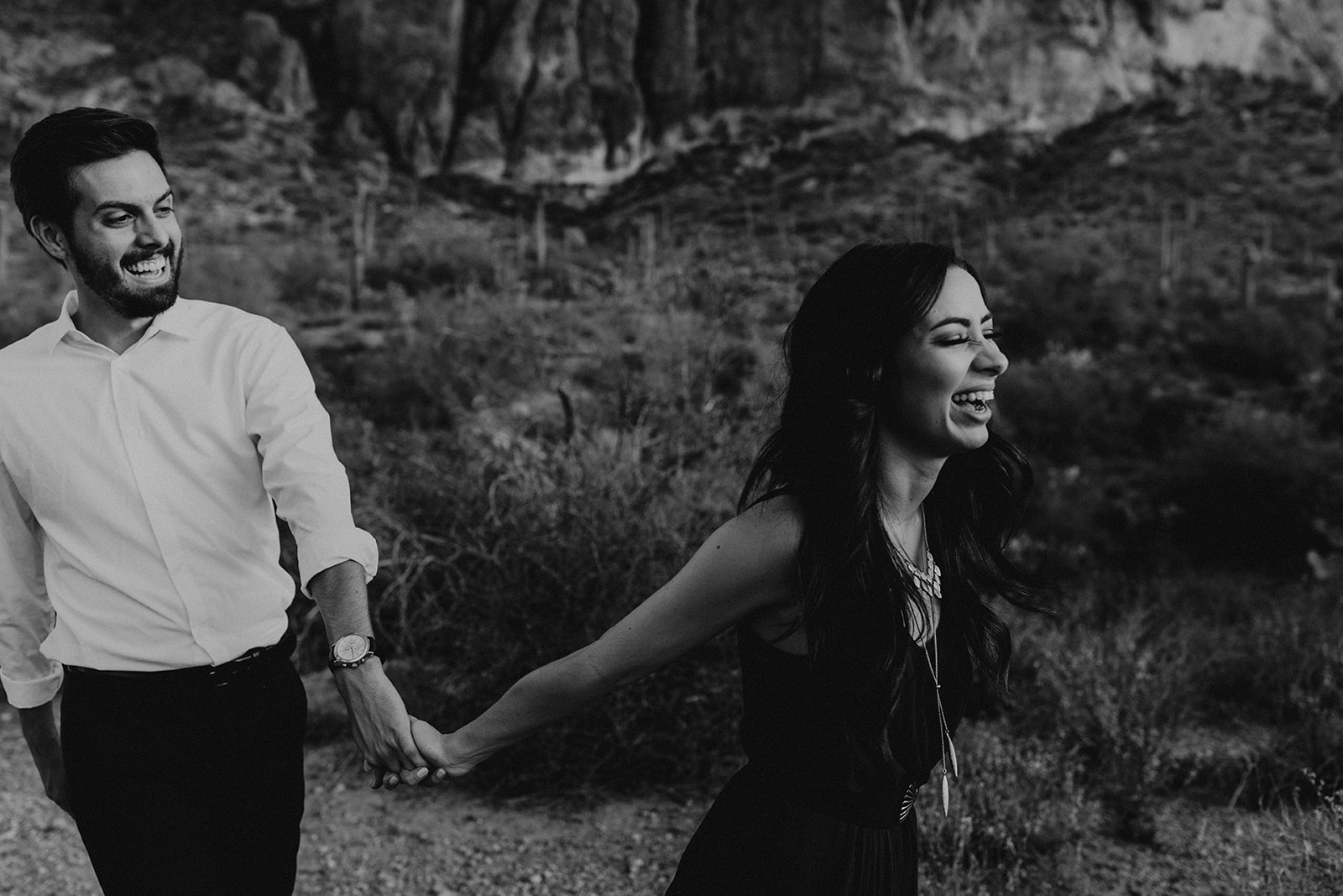 beautiful couple walk together sharing laughs 