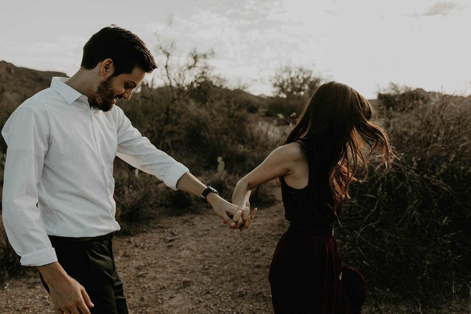 stunning couple pose in the Arizona nature during their hiking engagement photos