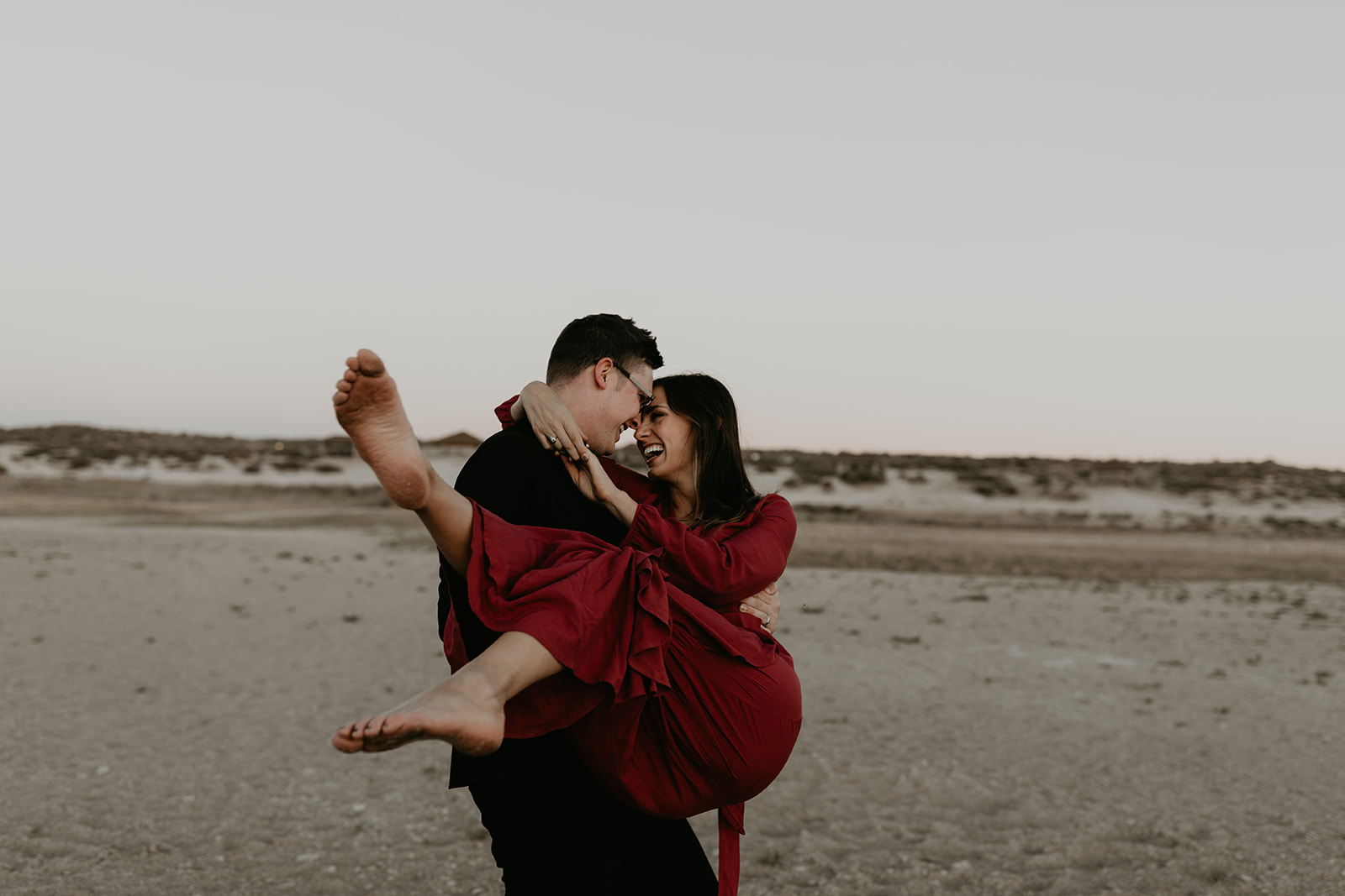 couple pose together in the gorgeous Utah nature during their outdoor engagement photoshoot 