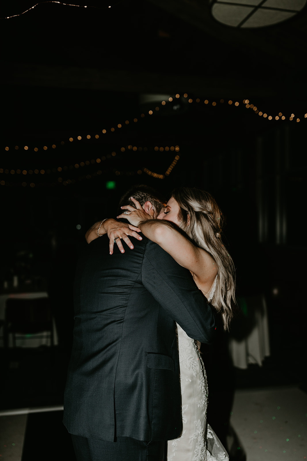 candid photos of the bride and groom sharing their first dance together 