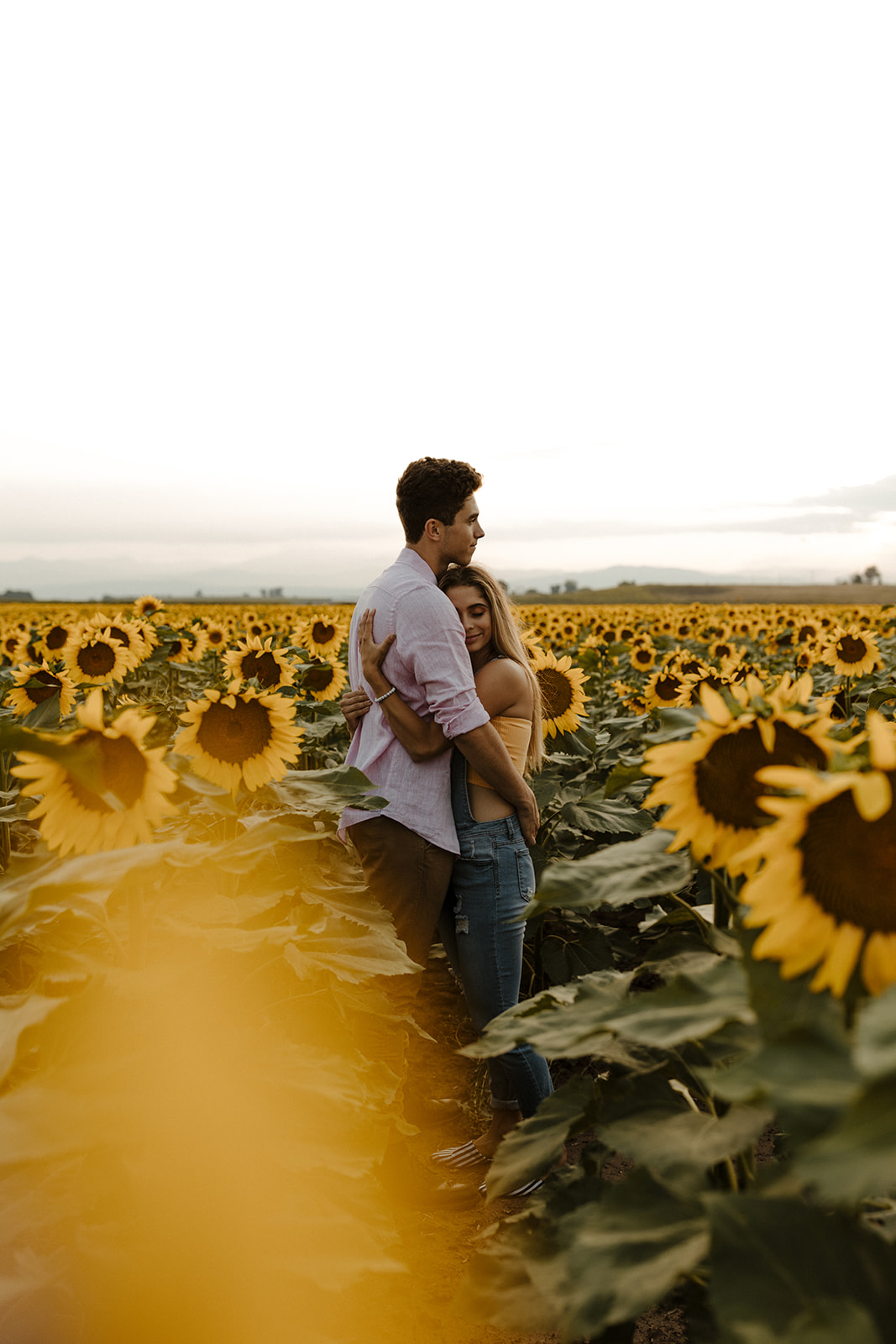 beautiful couple share a hug during their engagement photos 