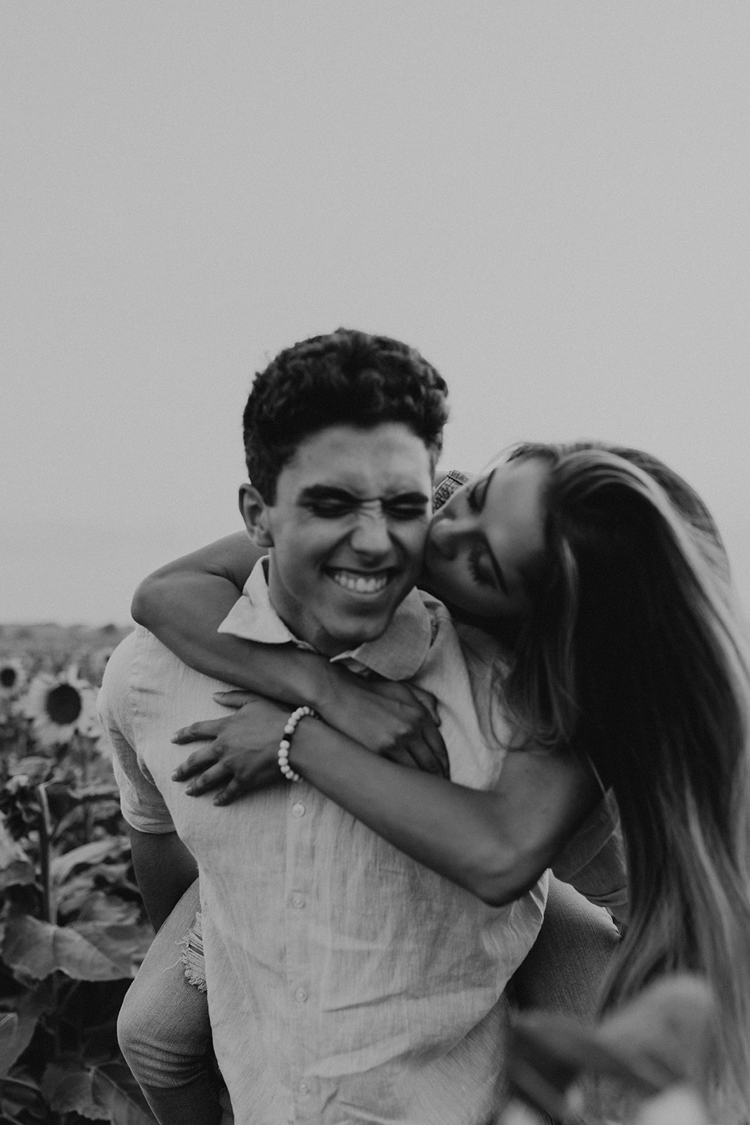 beautiful couple share a hug during their engagement photos 