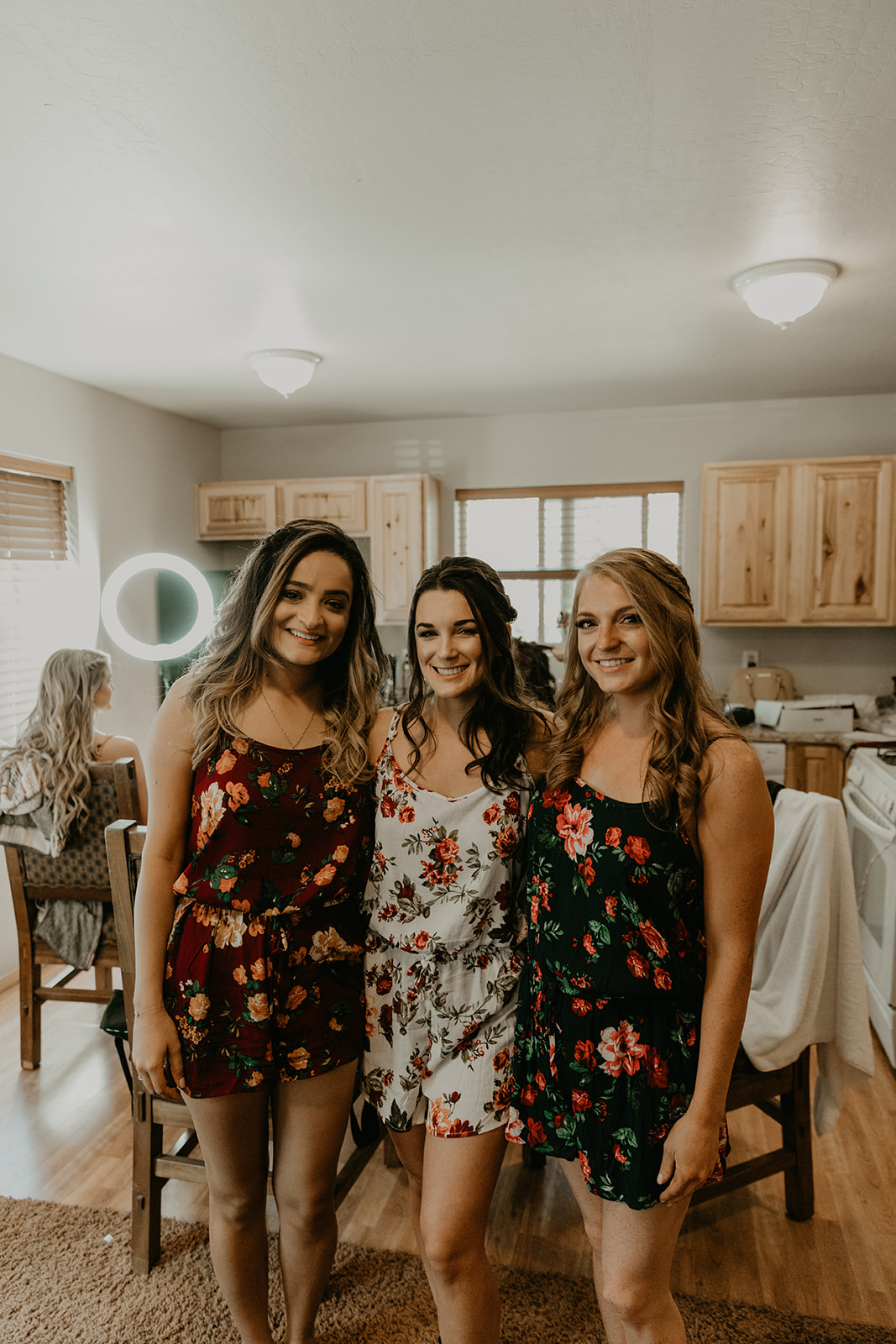 bride poses with her bridesmaids as they all prepare for the dreamy Mormon lake lodge wedding ceremony 