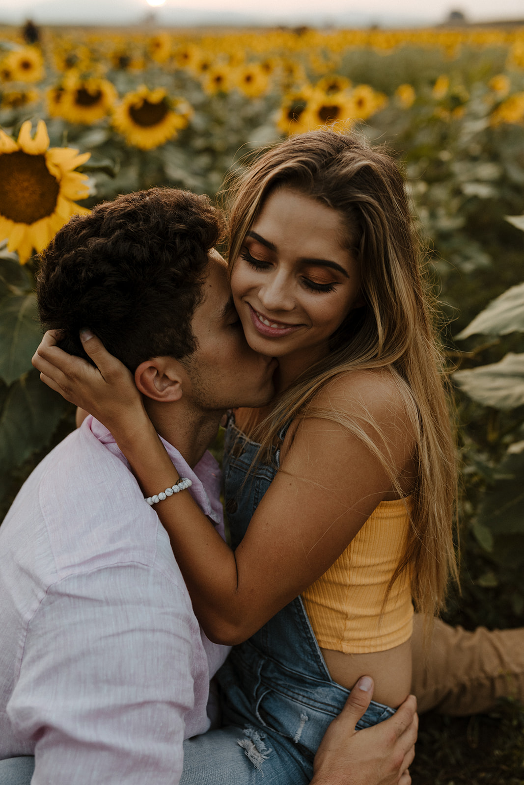 beautiful couple share a hug during their engagement photos 