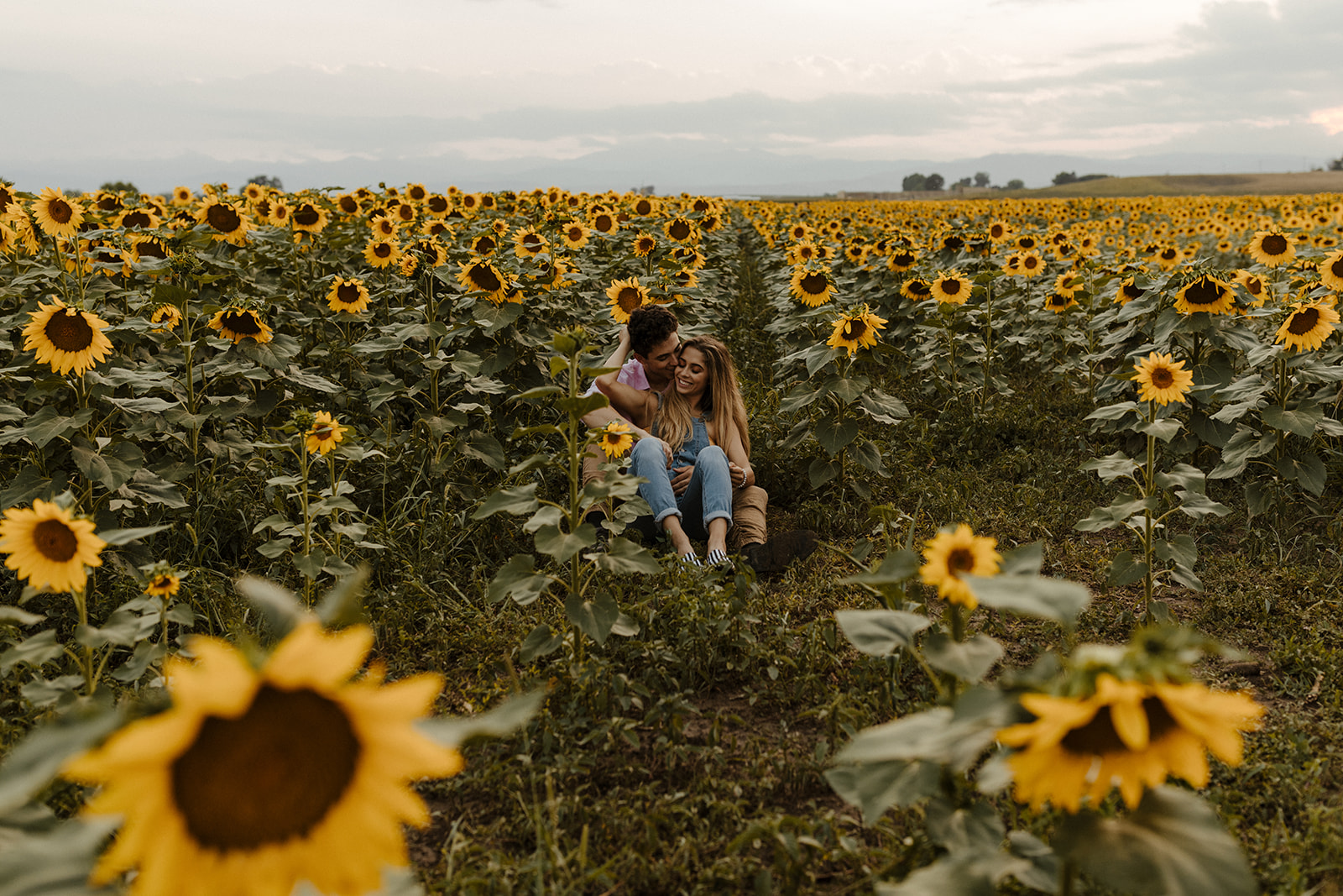 beautiful couple share a hug during their engagement photos 