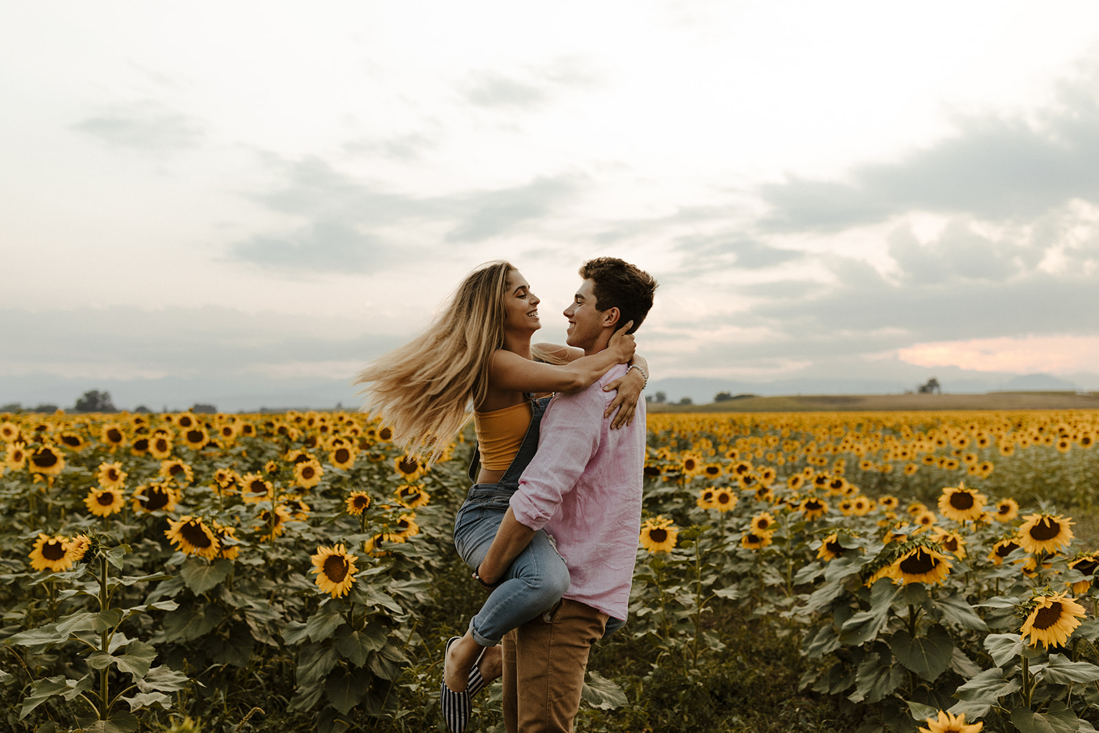 stunning couple pose casually during their engagement photoshoot 