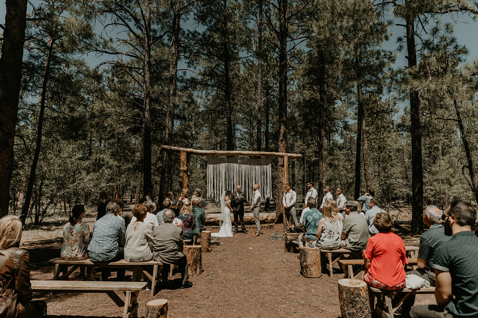 stunning outdoor wedding ceremony surrounded by trees