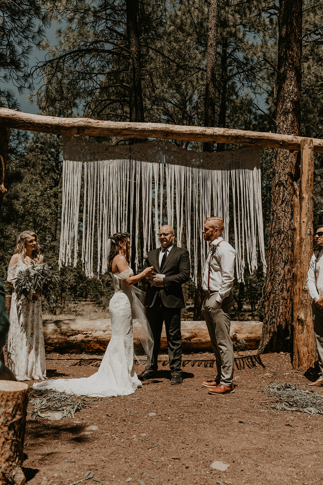 stunning outdoor wedding ceremony surrounded by trees