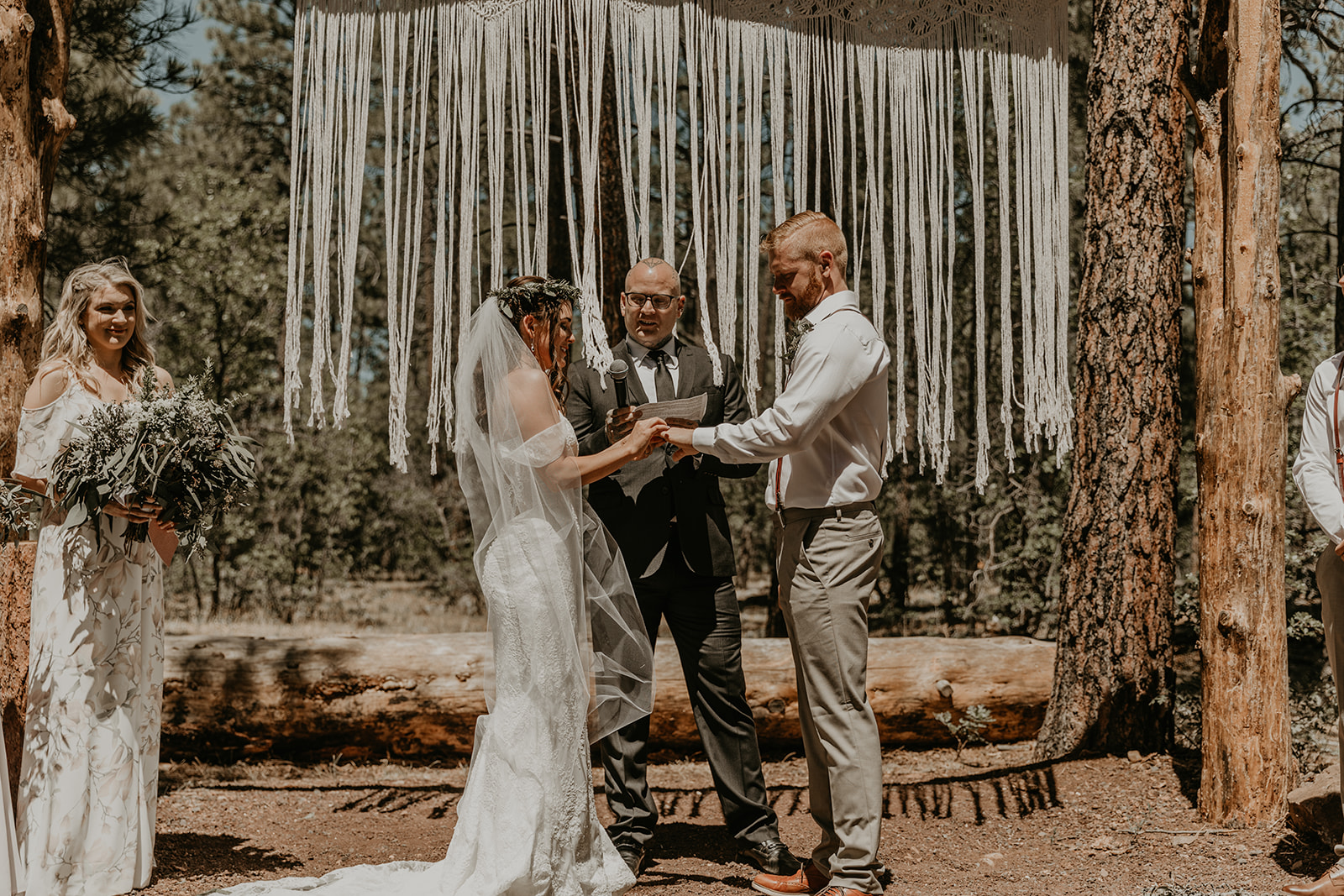 bride and groom share a moment together during their dreamy outdoor wedding ceremony