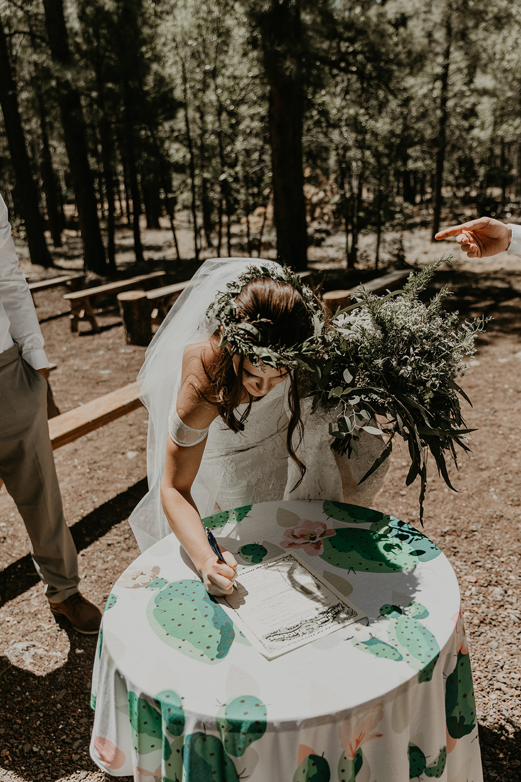 bride signs her marriage certificate 