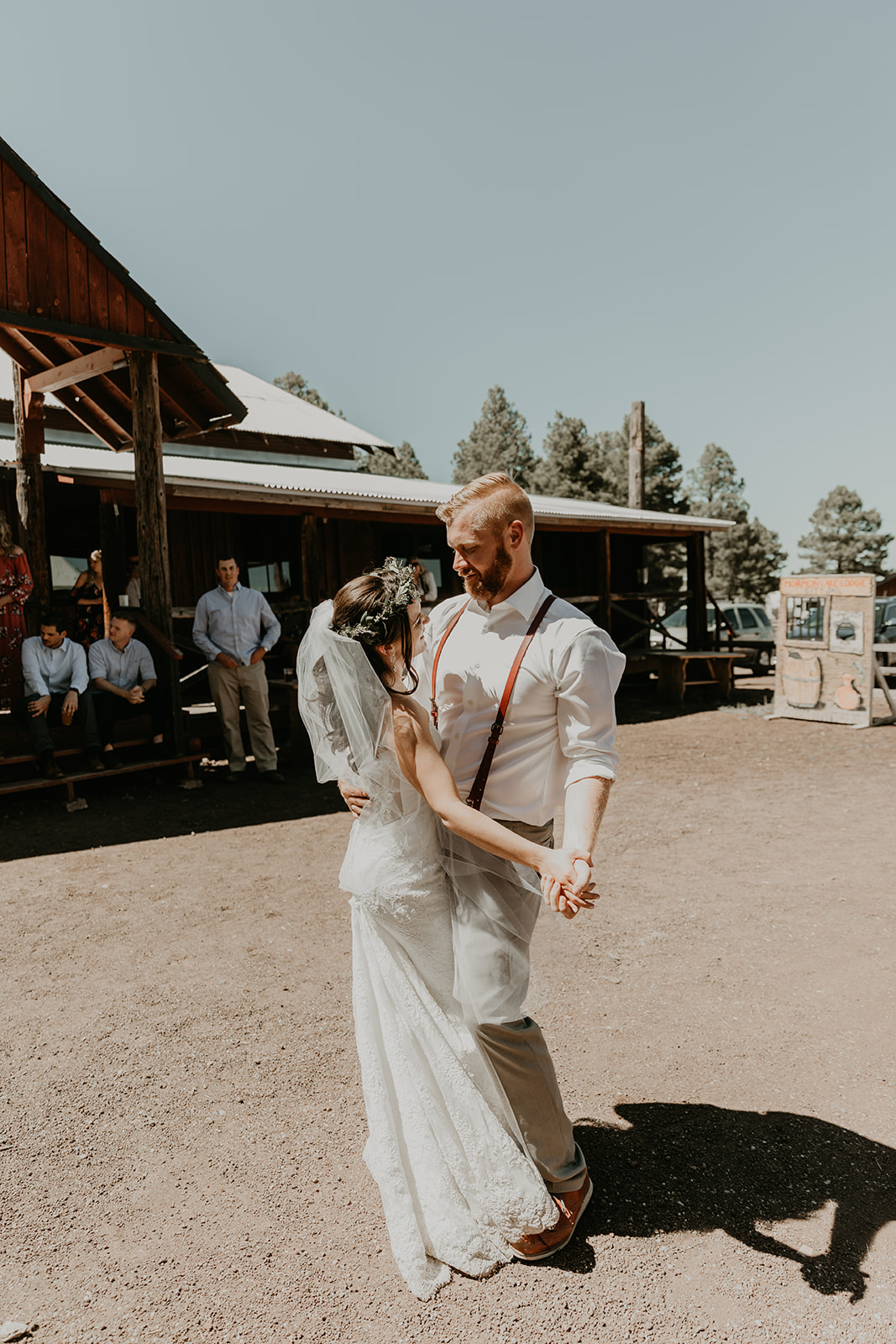 bride and groom dance outside the stunning wedding ceremony in the Arizona sun