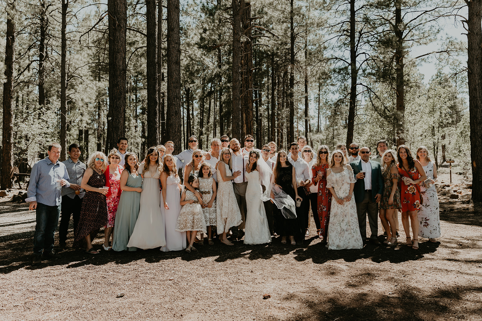 family poses together after a dreamy Arizona wedding day