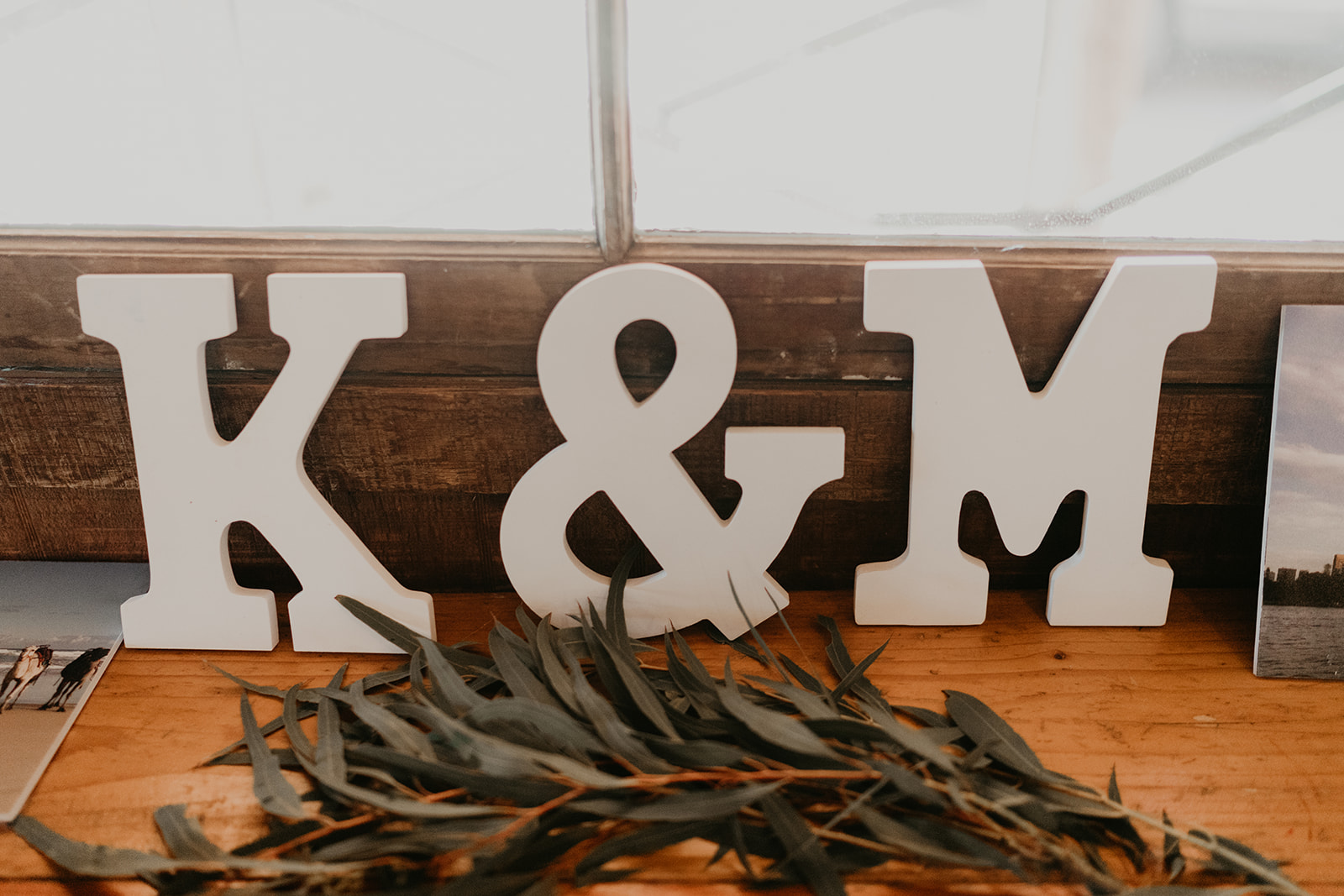 wedding signage stands with greenery at the dreamy wedding reception 