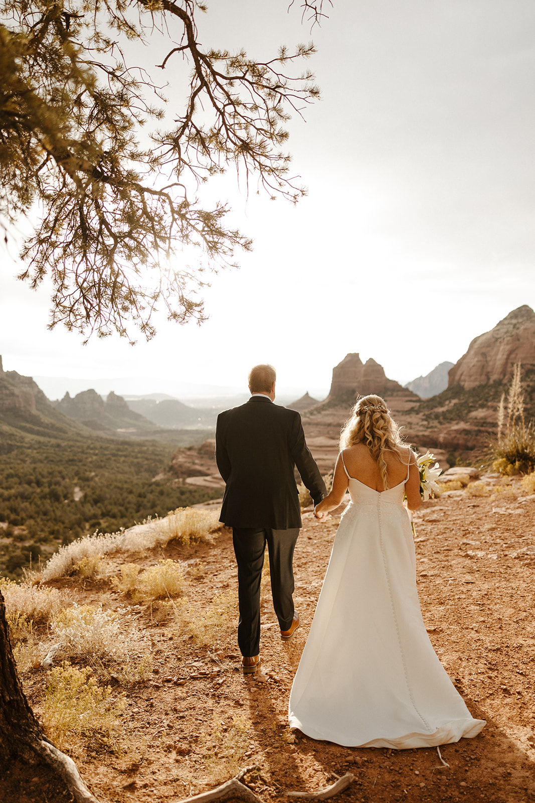 stunning bride and groom pose with the stunning Arizona nature in the background!