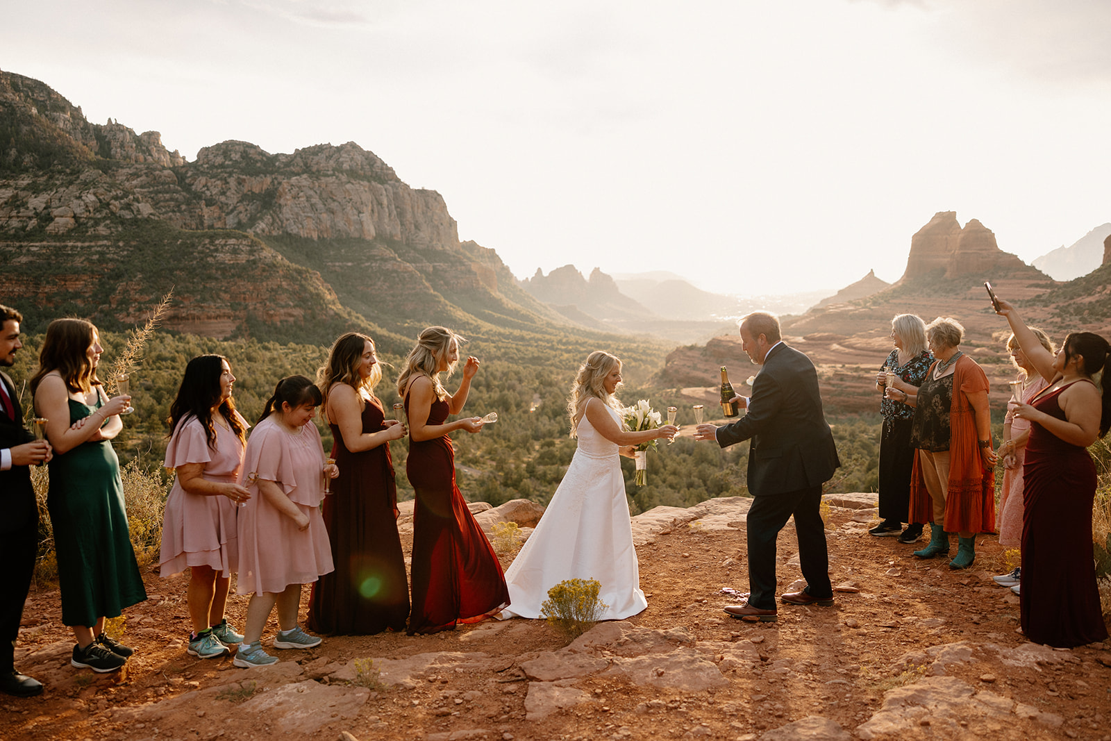 bride and groom come together with the Arizona nature in the background