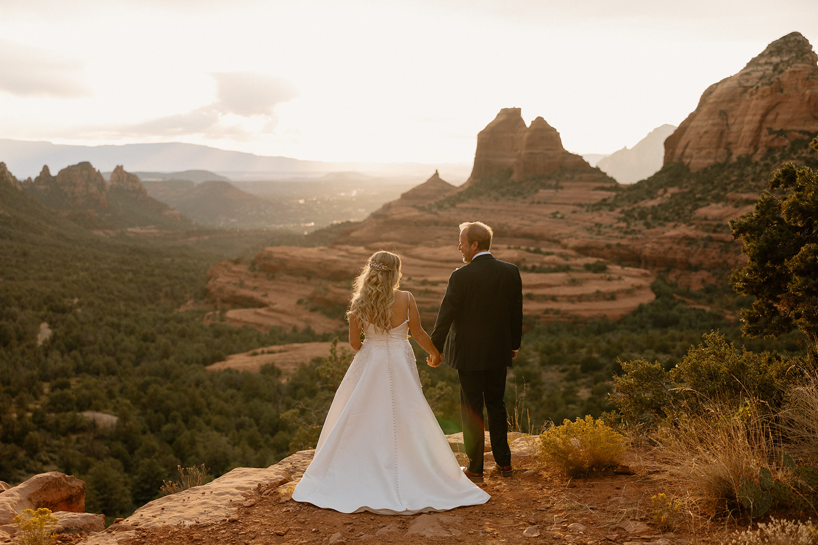 beautiful bride and groom pose with the stunning Arizona nature in the background!