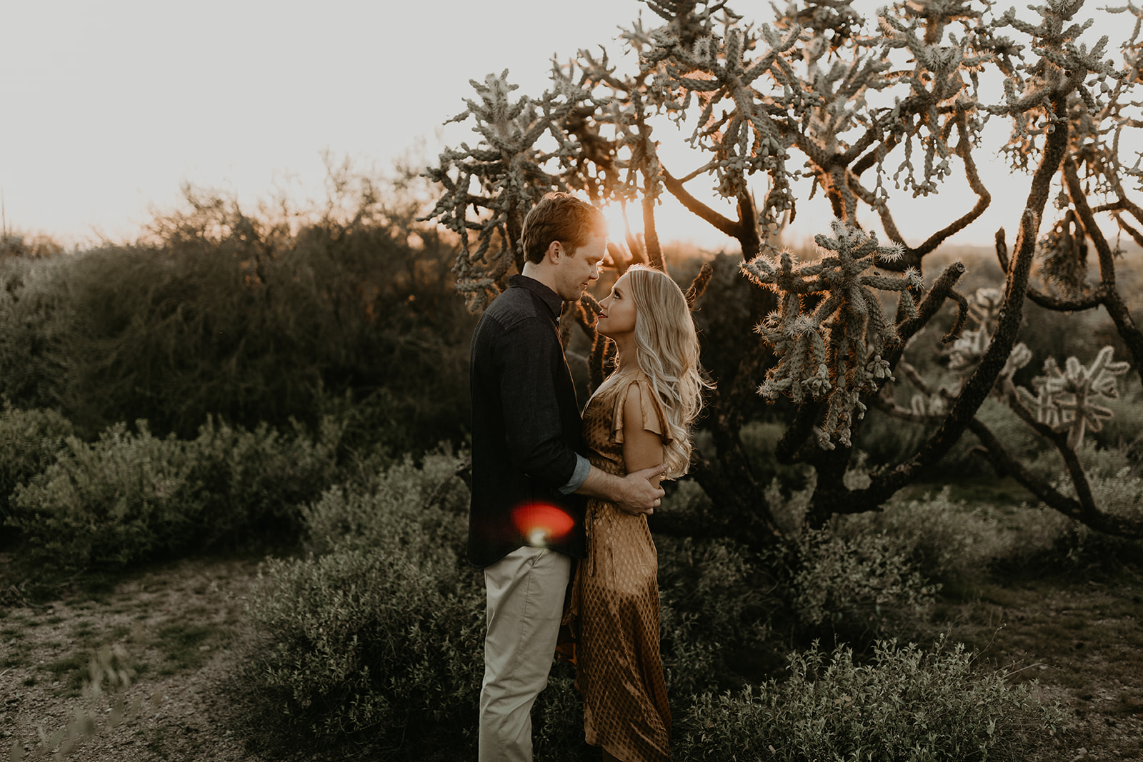 stunning couple pose together in the Arizona desert