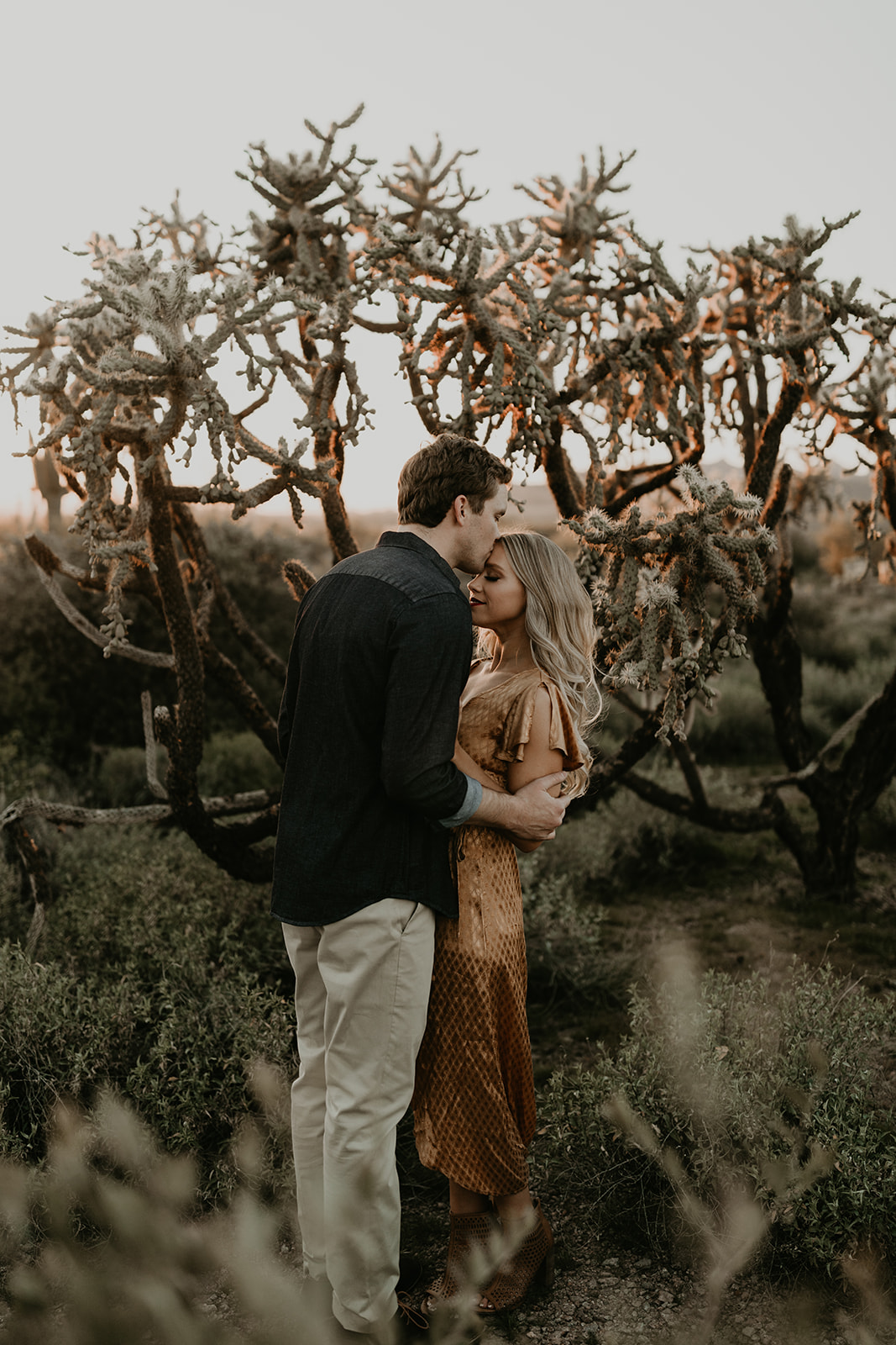 stunning couple pose together in the Arizona desert