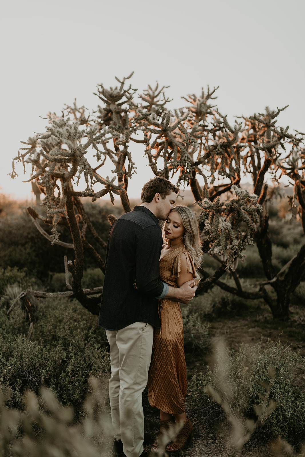 stunning couple pose together in the Arizona desert