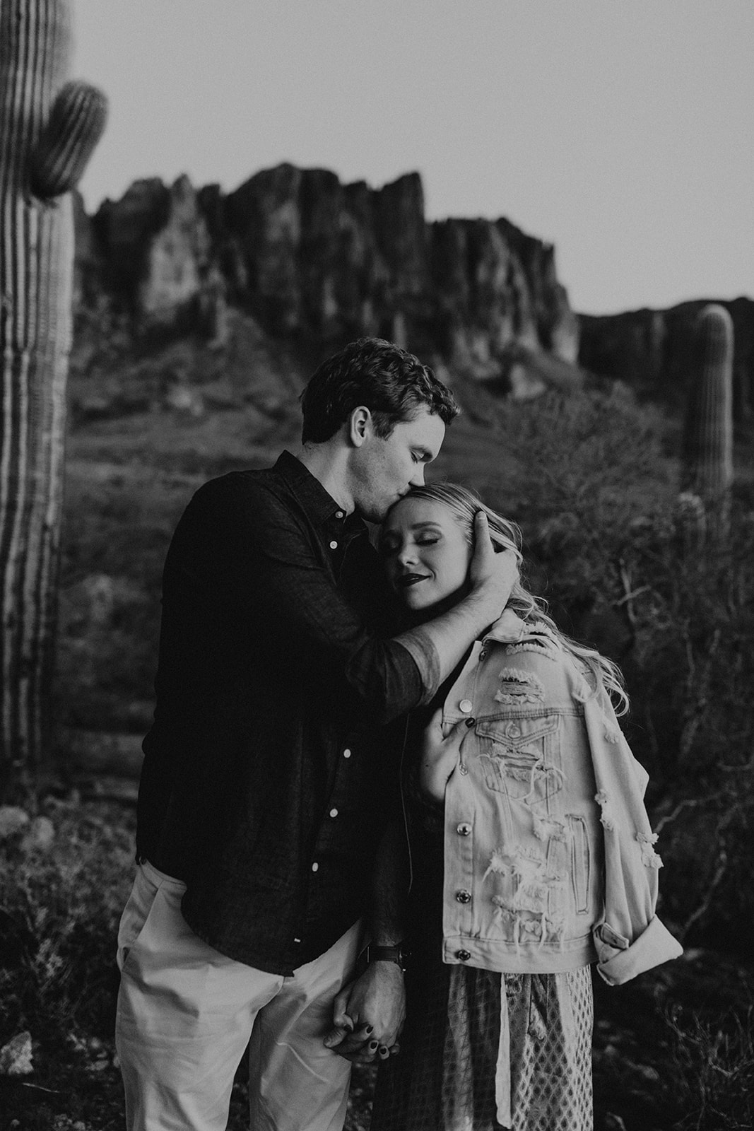 stunning couple pose together in the Arizona desert