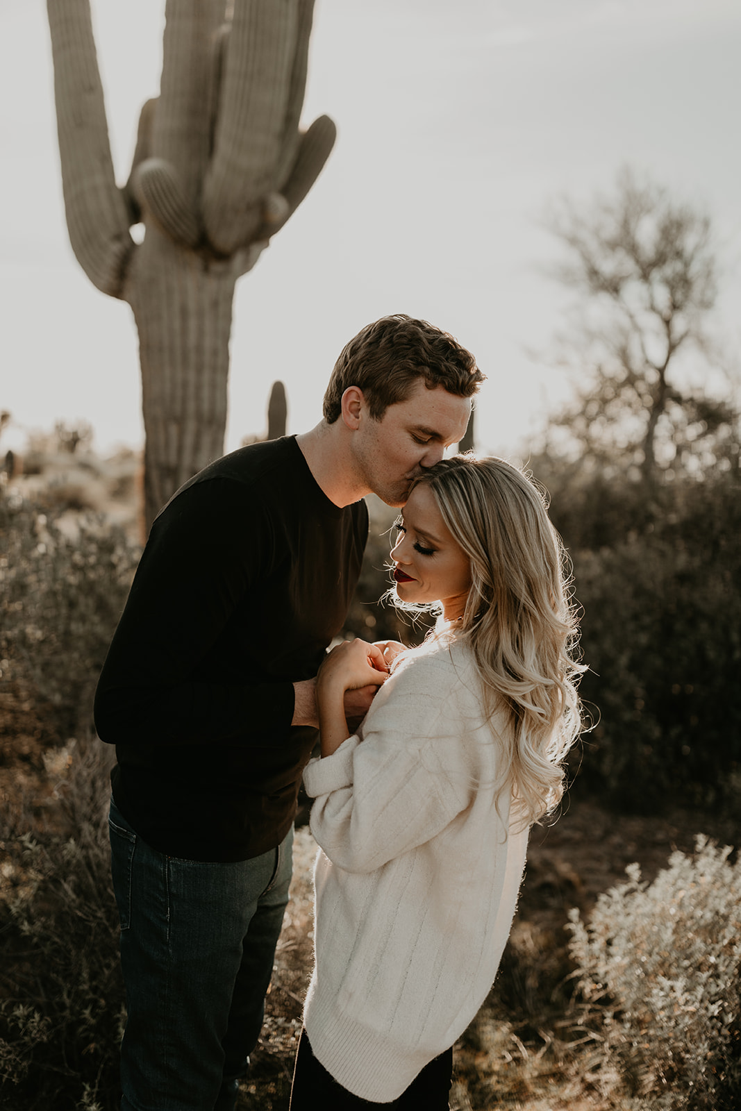 beautiful couple pose together during their lost dutchman state park