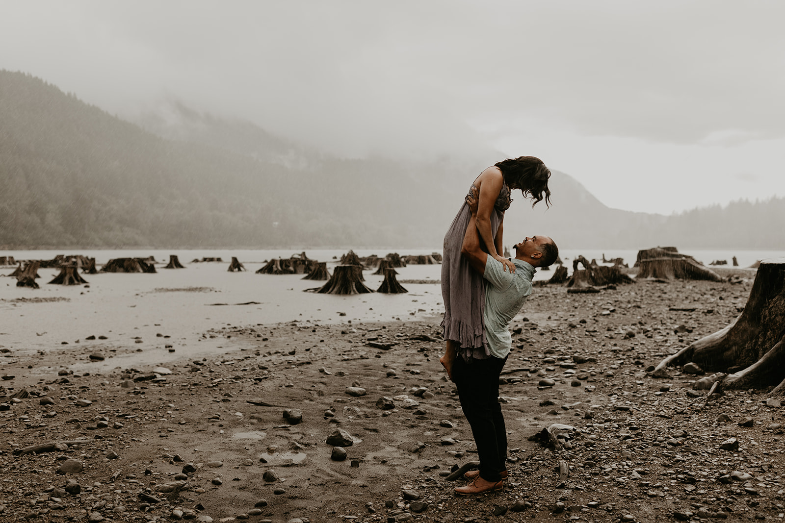 stunning couple pose together during their Rattlesnake lake engagement photoshoot