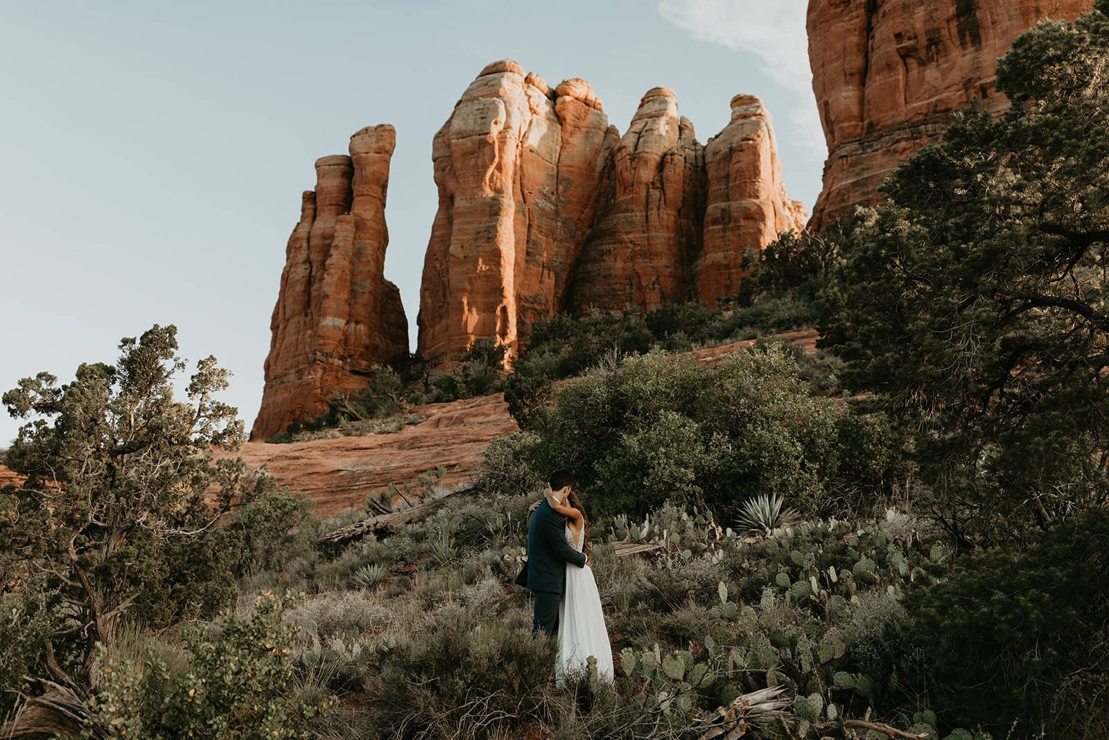 stunning couple pose together for their Sedona cathedral adventure engagement photos