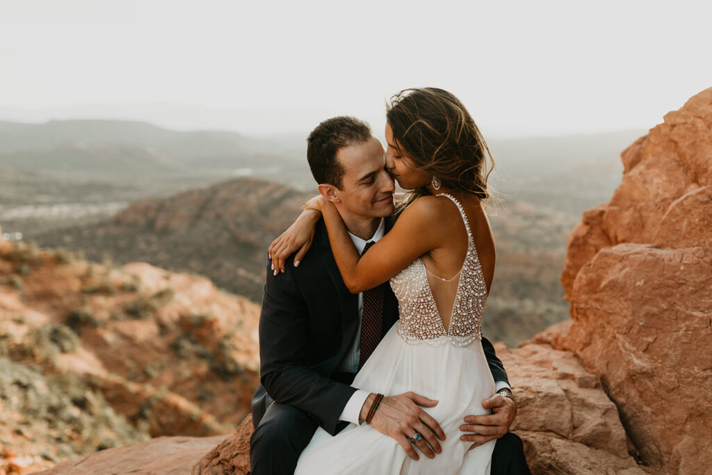 stunning couple pose together for their Sedona cathedral adventure engagement photos