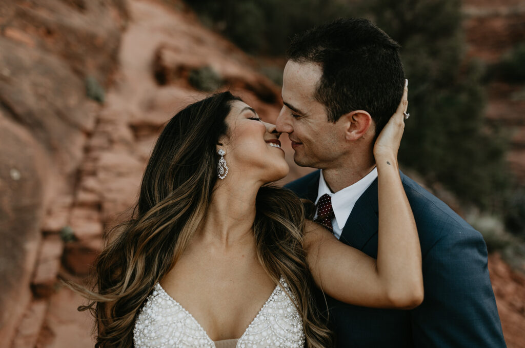 stunning couple pose together for their Sedona cathedral adventure engagement photos