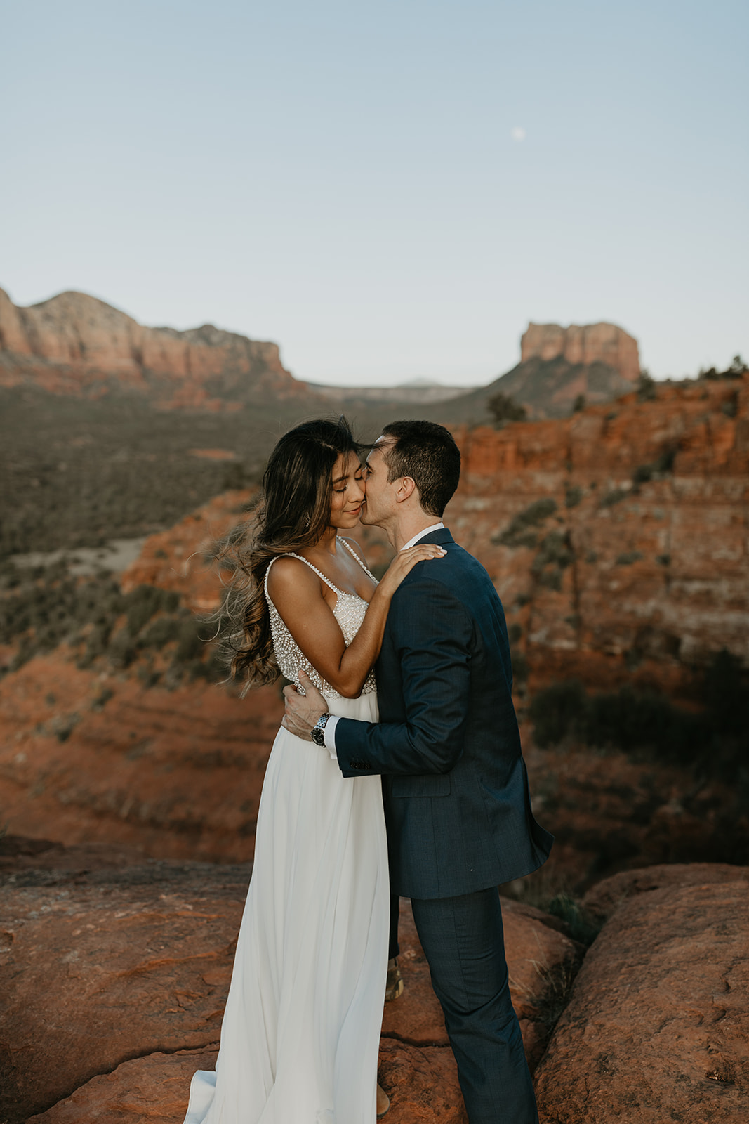 stunning couple pose together for their Sedona cathedral adventure engagement photos