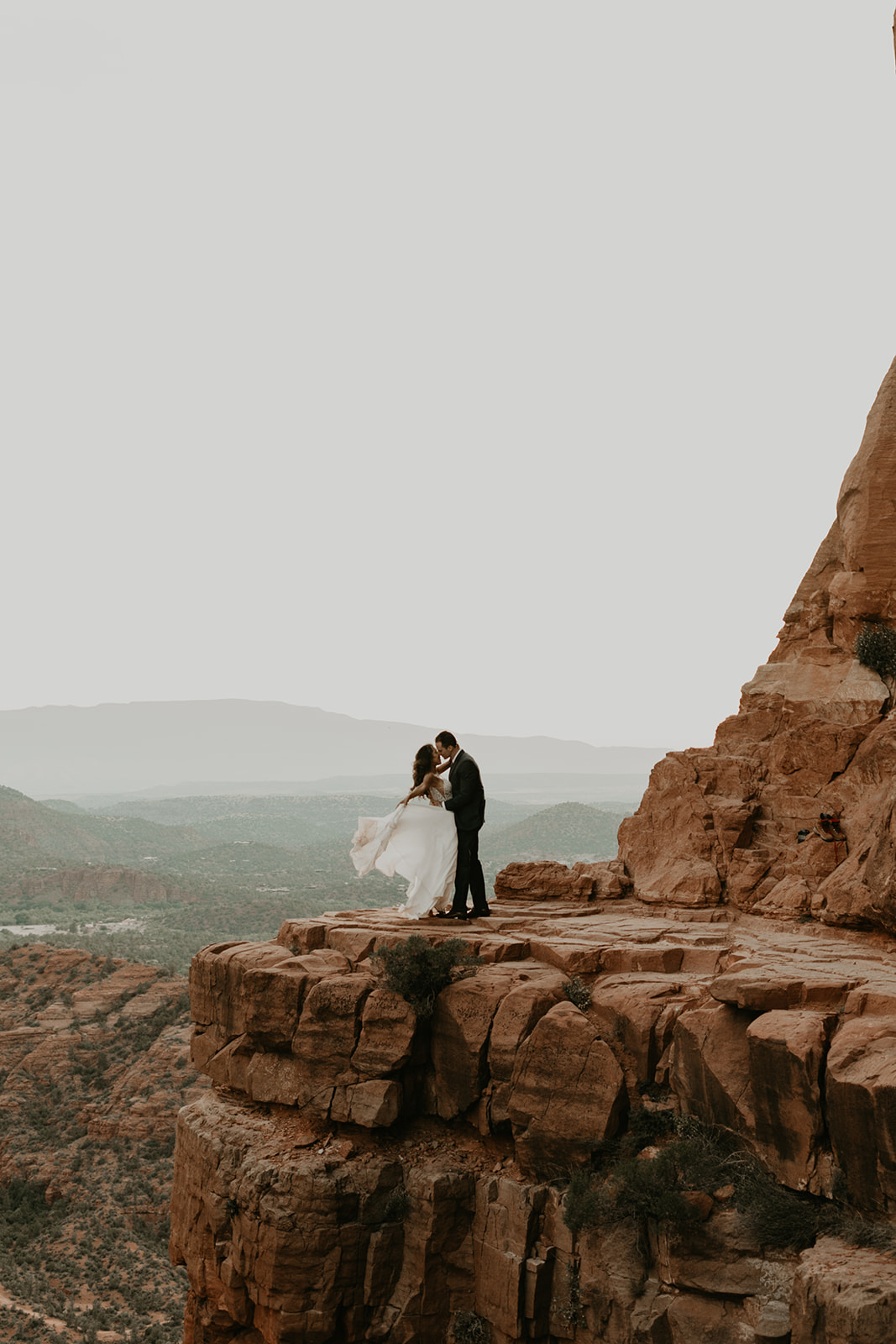 stunning couple pose with the Arizona valley in the background