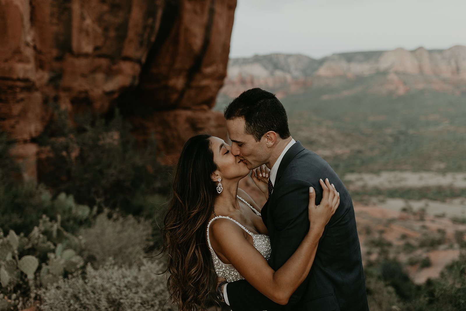 stunning couple pose with the Arizona valley in the background