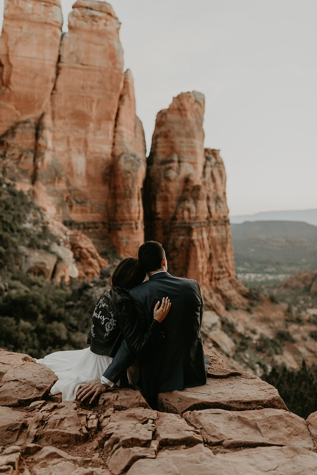 stunning couple pose together for their Sedona cathedral adventure engagement photos