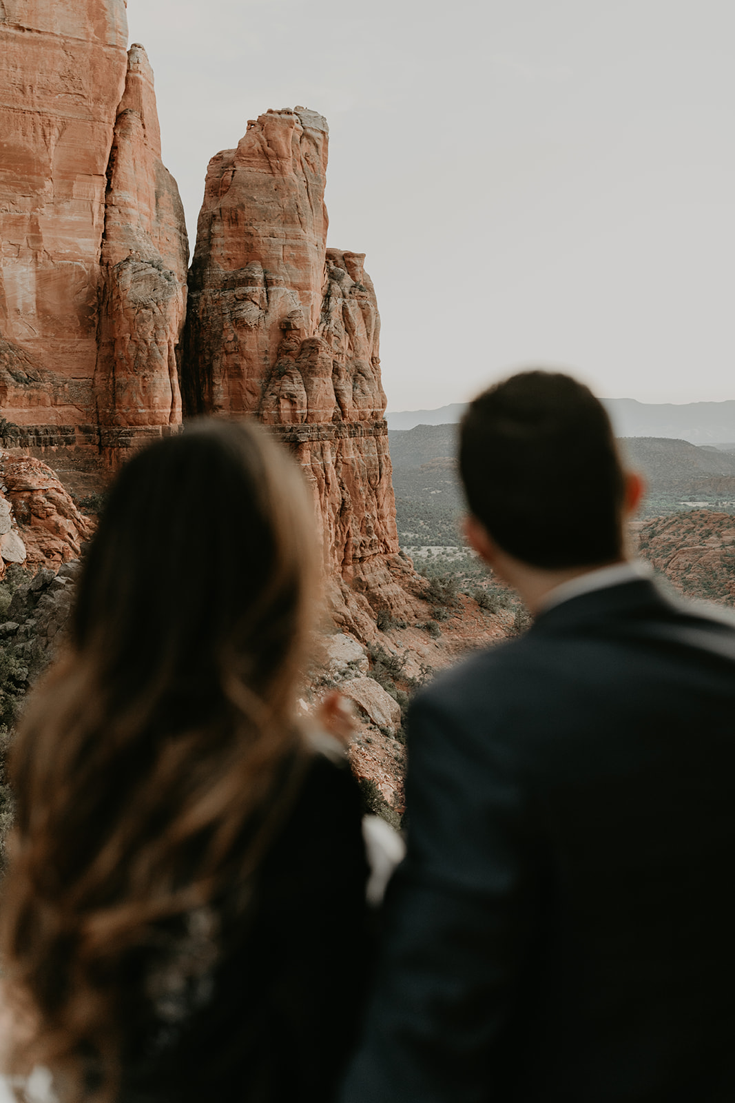 stunning couple pose with the Arizona valley in the background