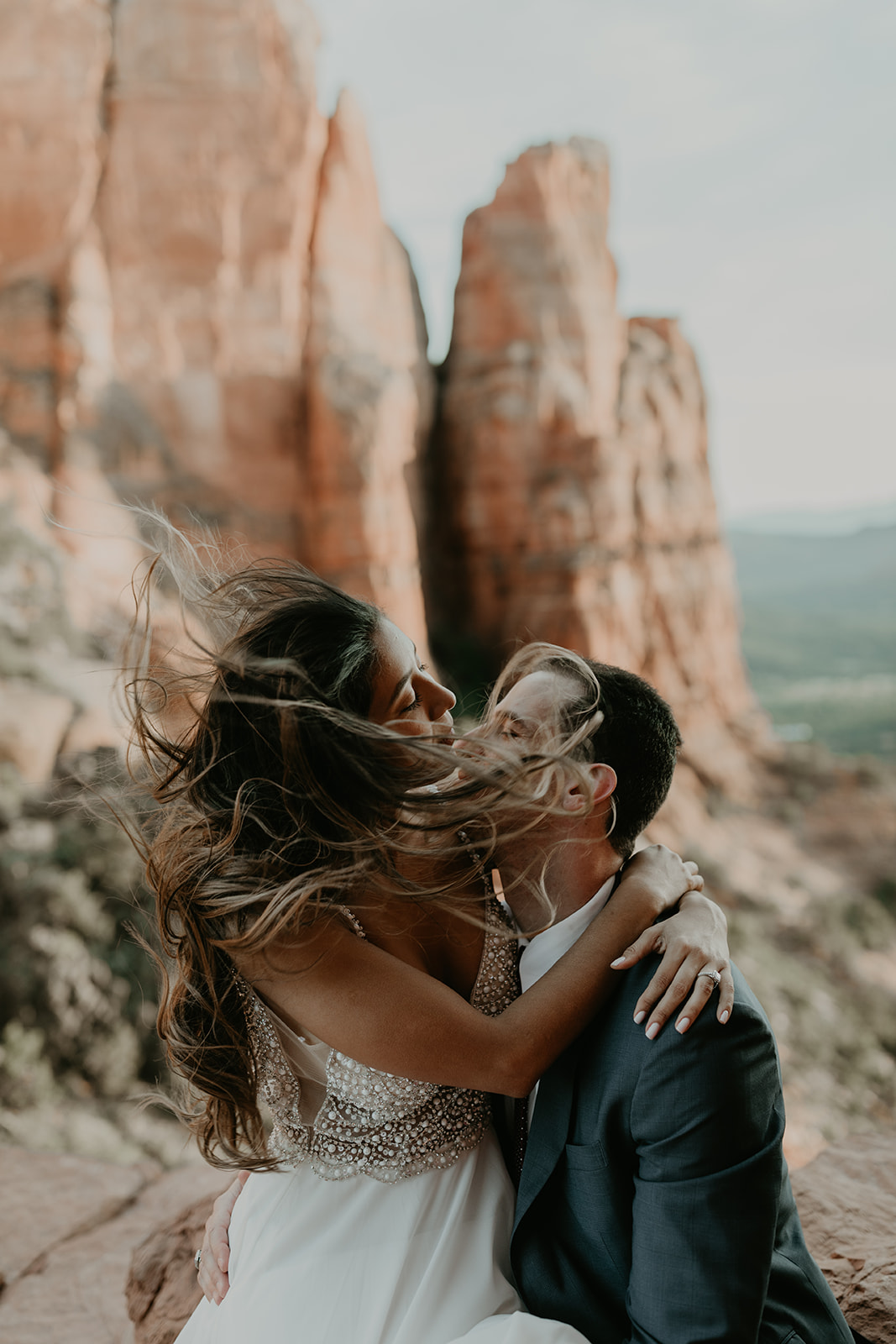 stunning couple pose together for their Sedona cathedral adventure engagement photos