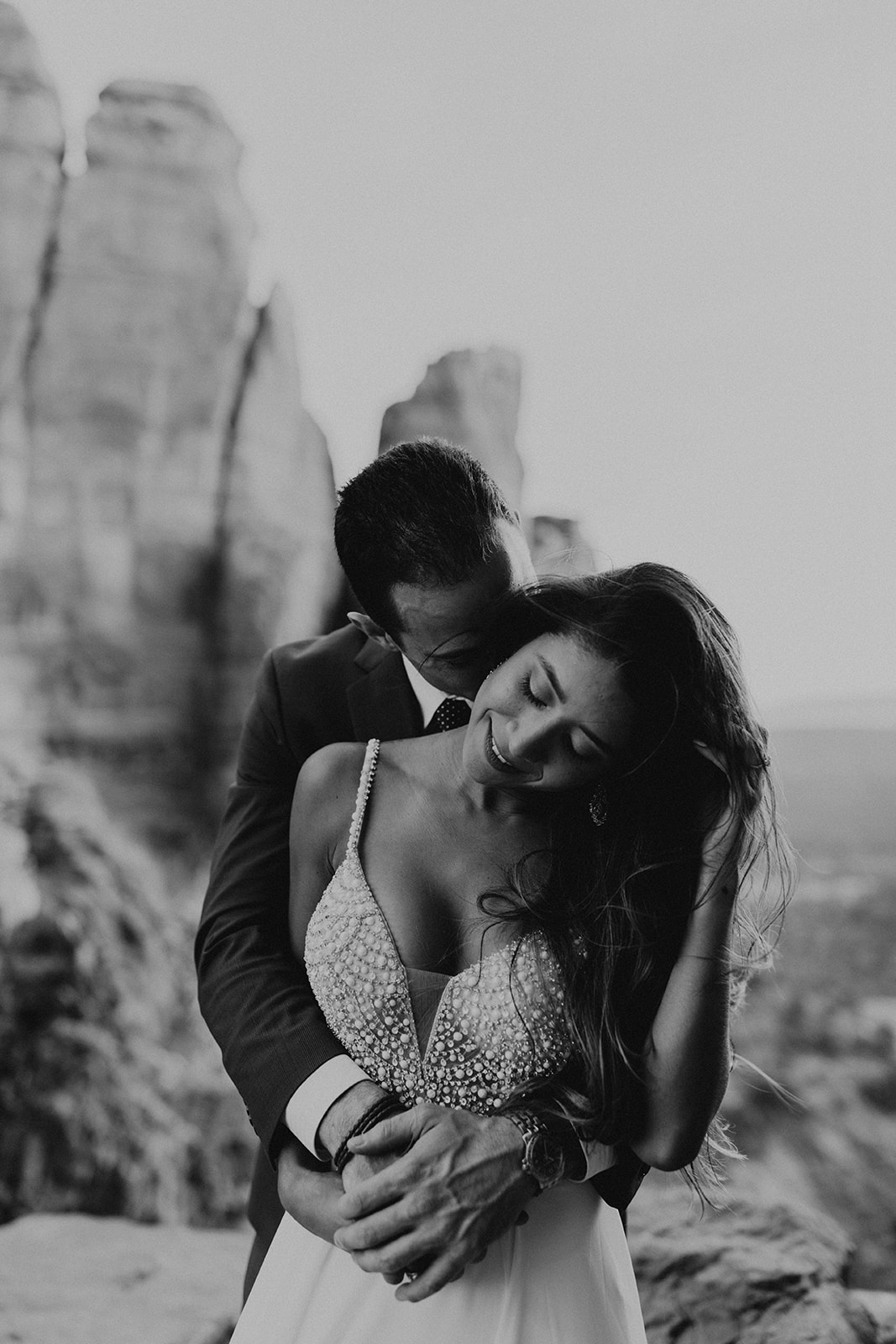 stunning couple pose together for their Sedona cathedral adventure engagement photos