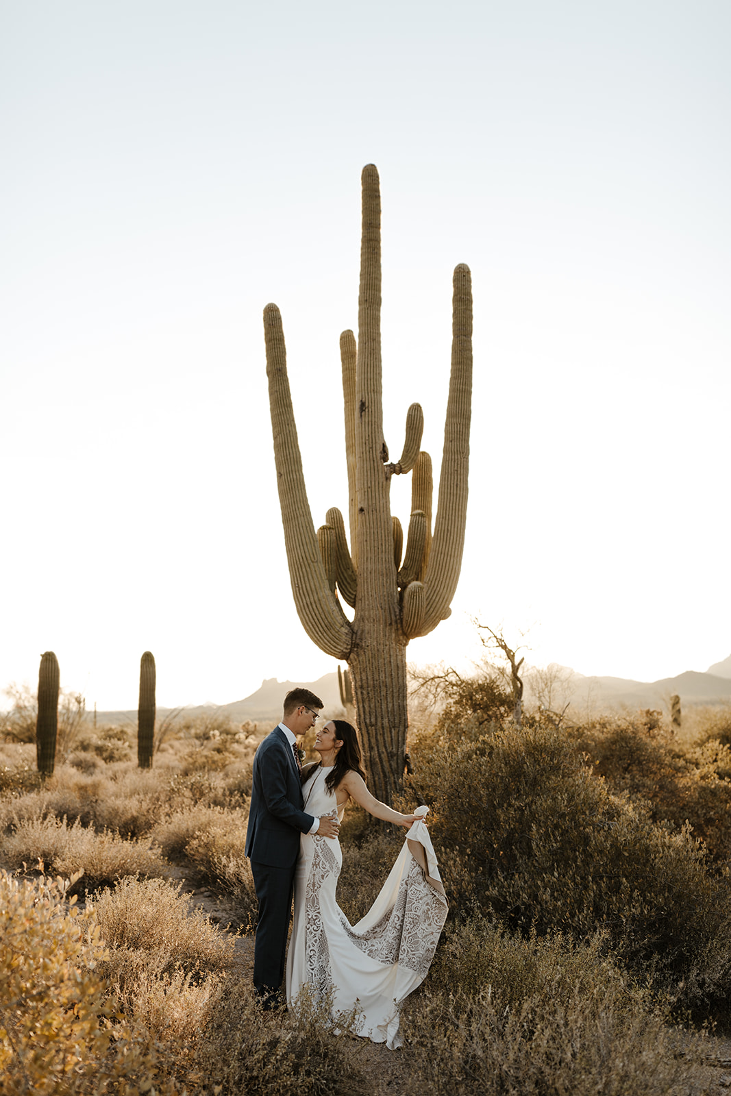 stunning bride and groom pose for a photo after their Apache Junction wedding ceremony