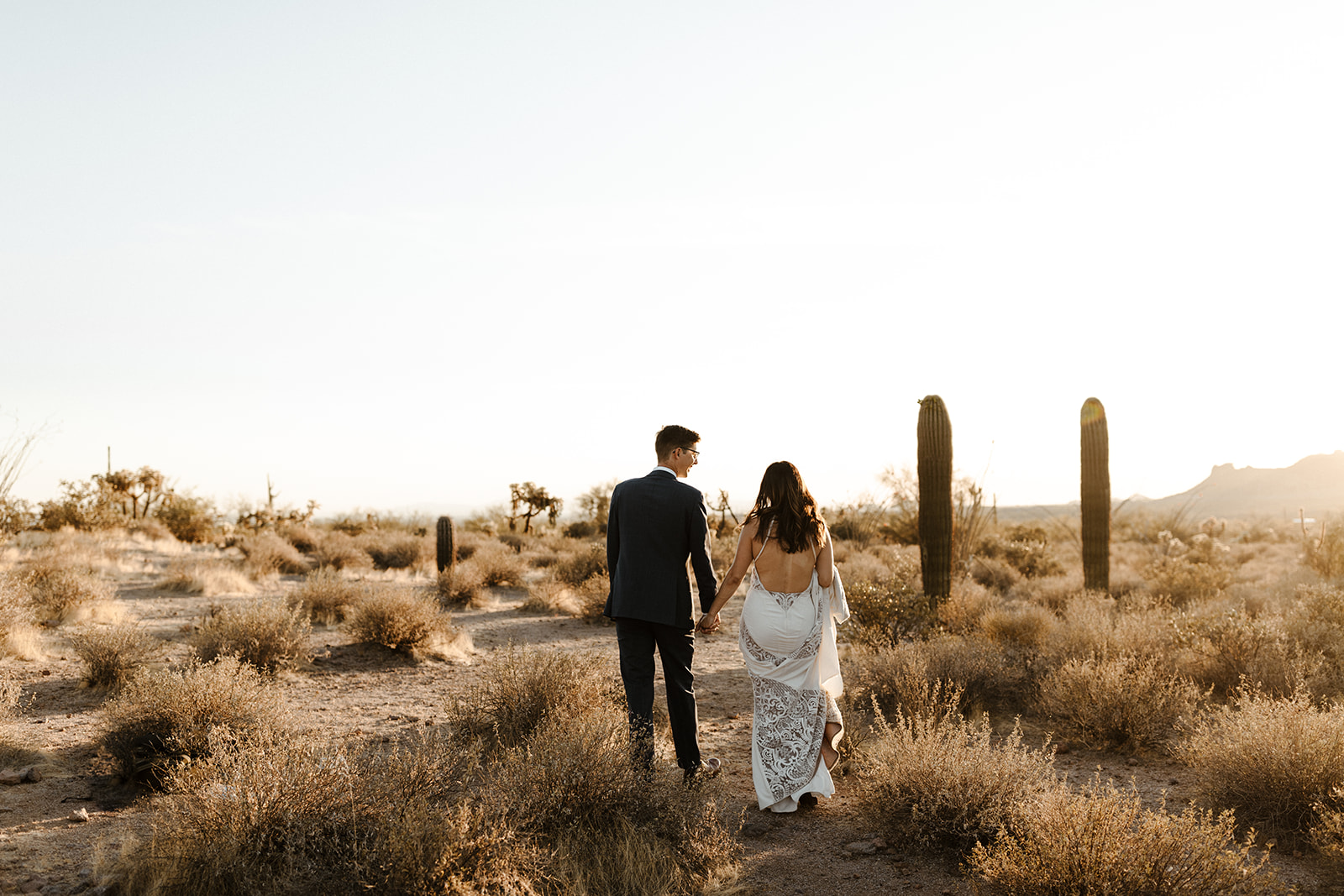 stunning bride and groom pose for a photo after their Apache Junction wedding ceremony