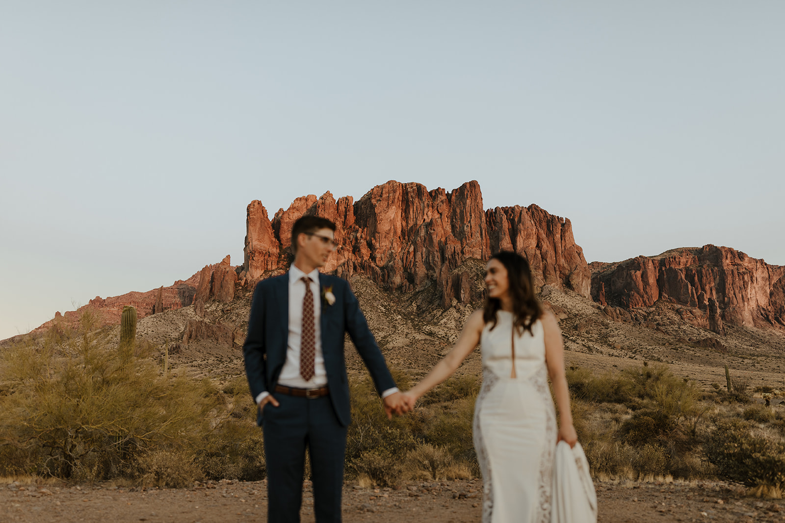 stunning bride and groom pose for a photo after their Apache Junction wedding ceremony