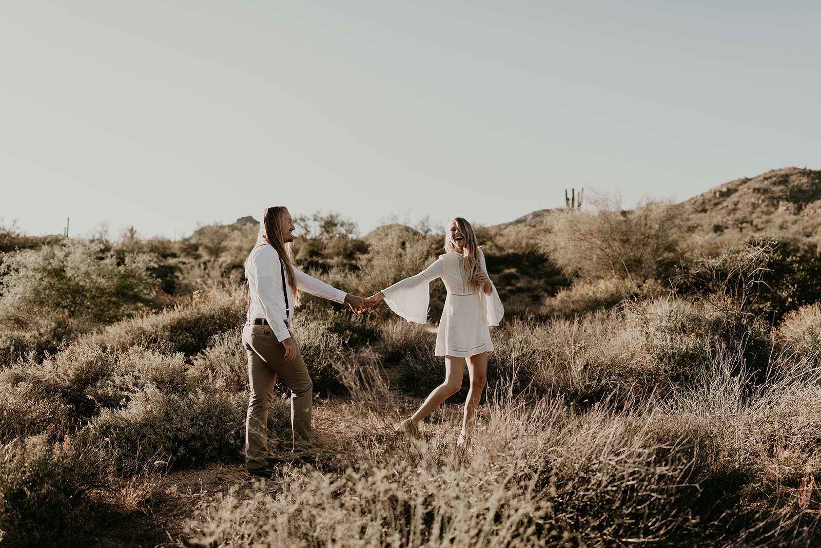 beautiful couple pose together in the Arizona desert