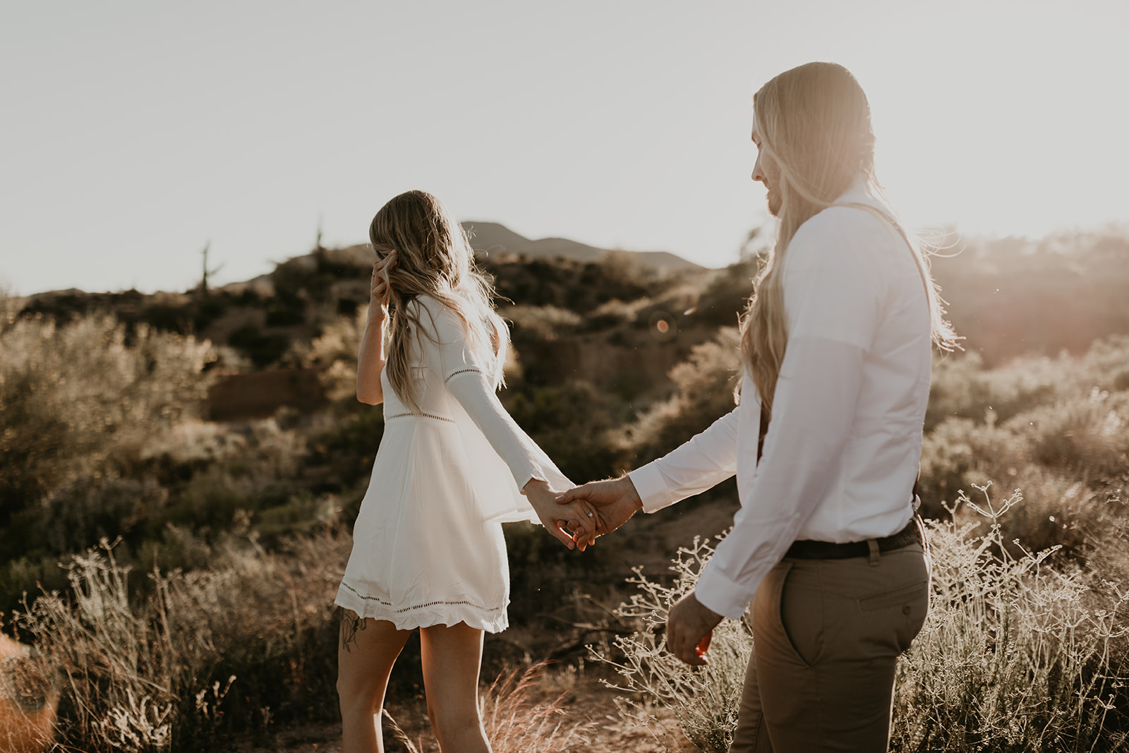 beautiful couple pose together in the Arizona desert