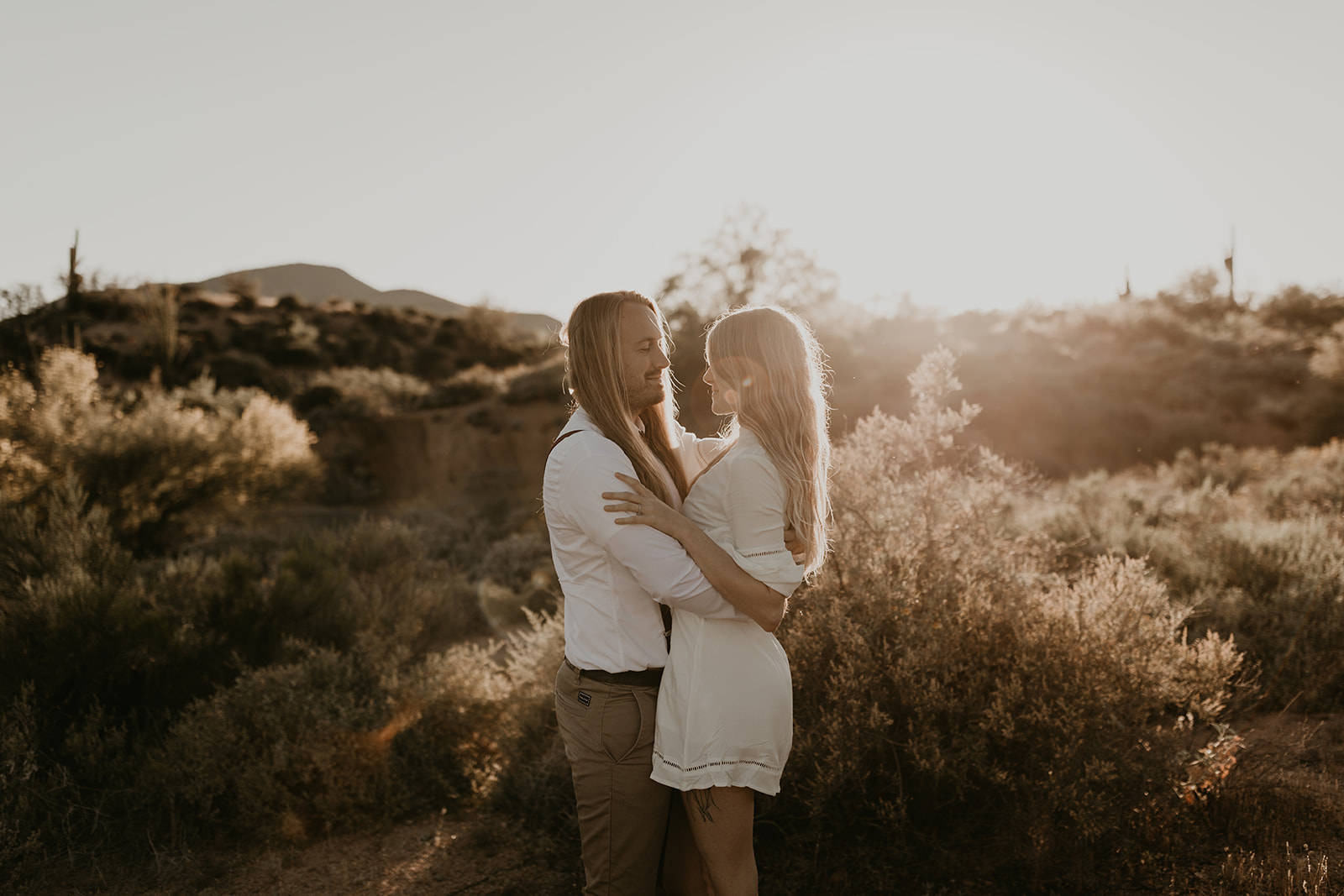 beautiful couple pose together in the Arizona desert