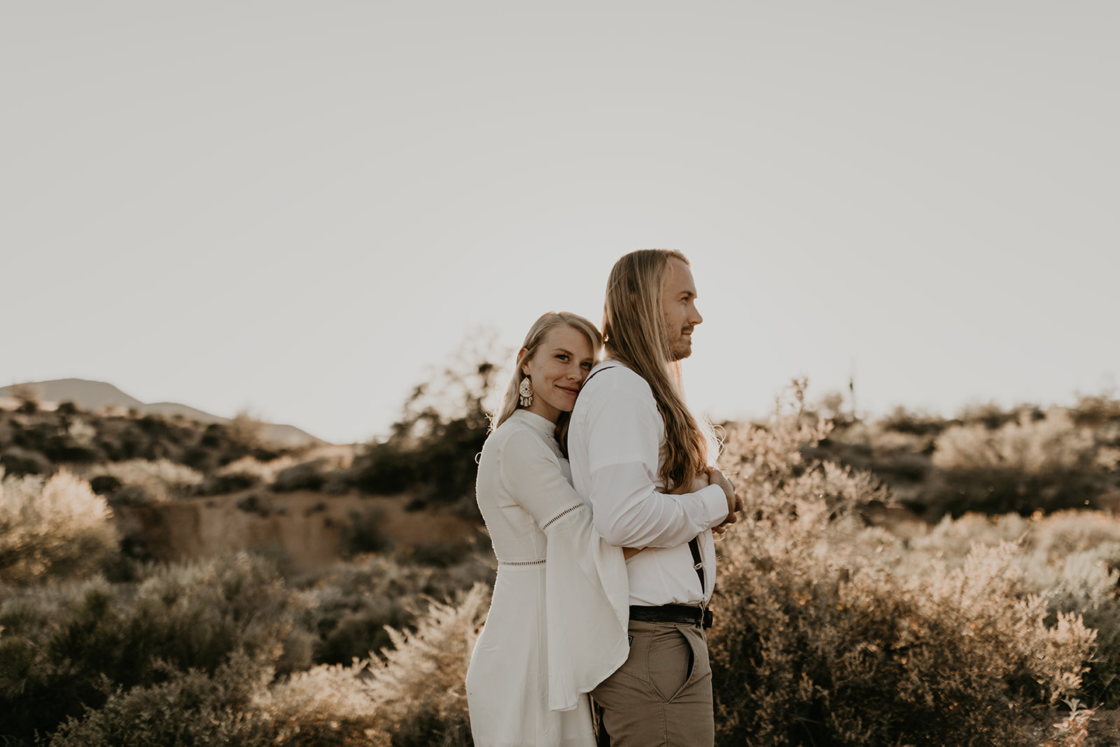 beautiful couple pose together in the Arizona desert