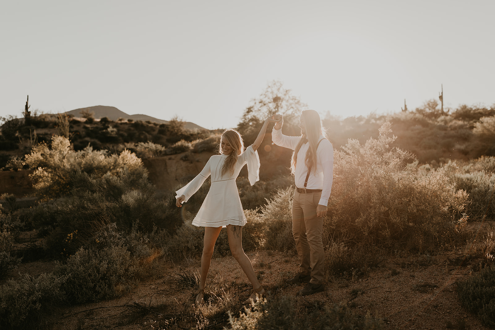 beautiful couple pose together in the Arizona desert