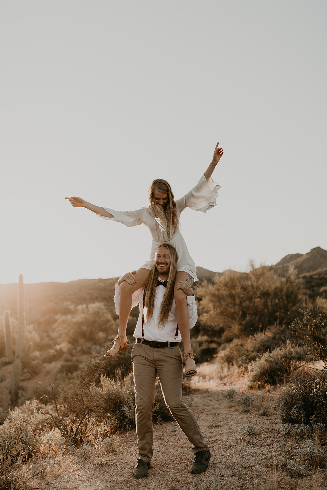 beautiful couple pose together in the Arizona desert