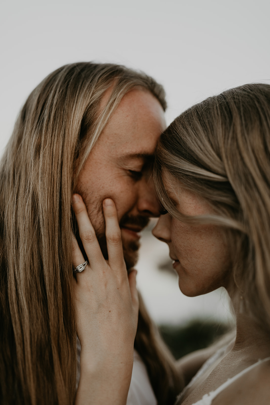 couple share a kiss during their Arizona engagement photoshoot