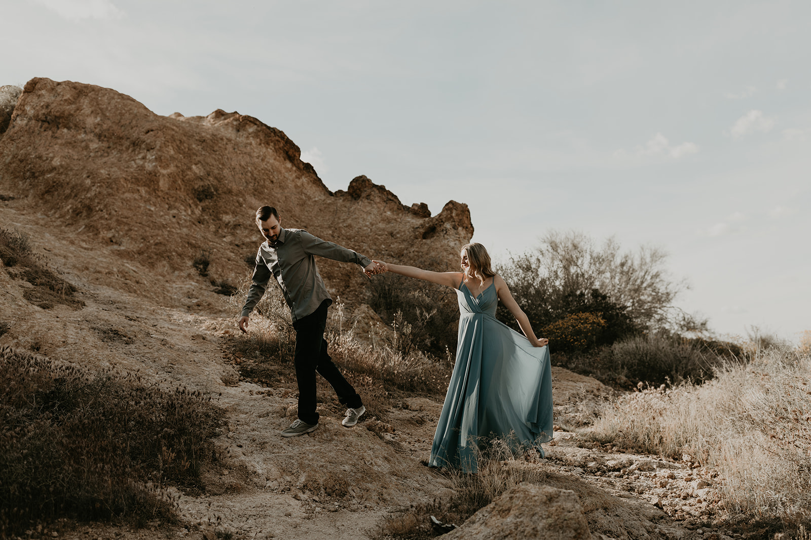 stunning couple pose together in Arizona during their dreamy Canyon Lake engagement photoshoot