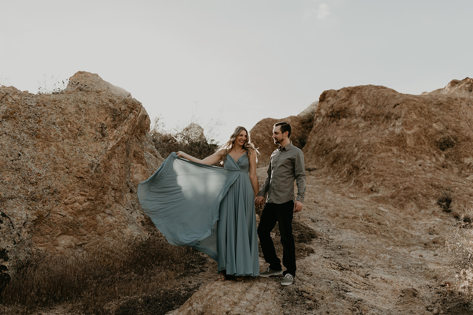 couple pose together during their Arizona engagement photo session