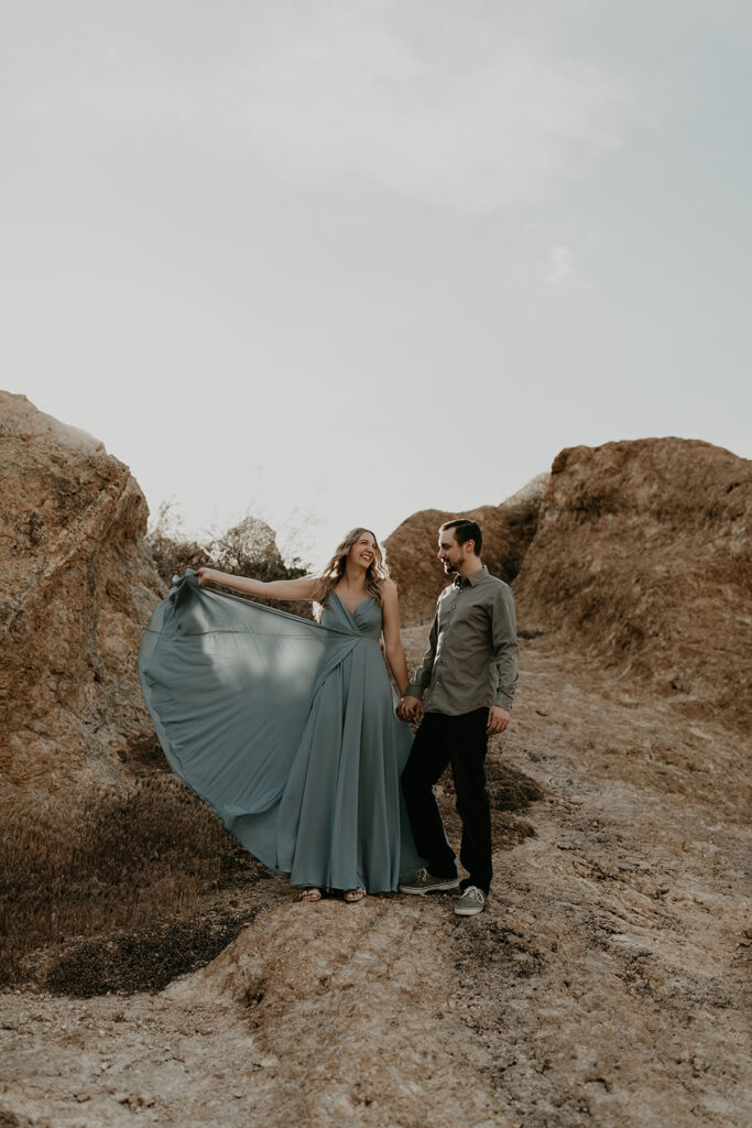 stunning couple pose together in Arizona during their dreamy Canyon Lake engagement photoshoot