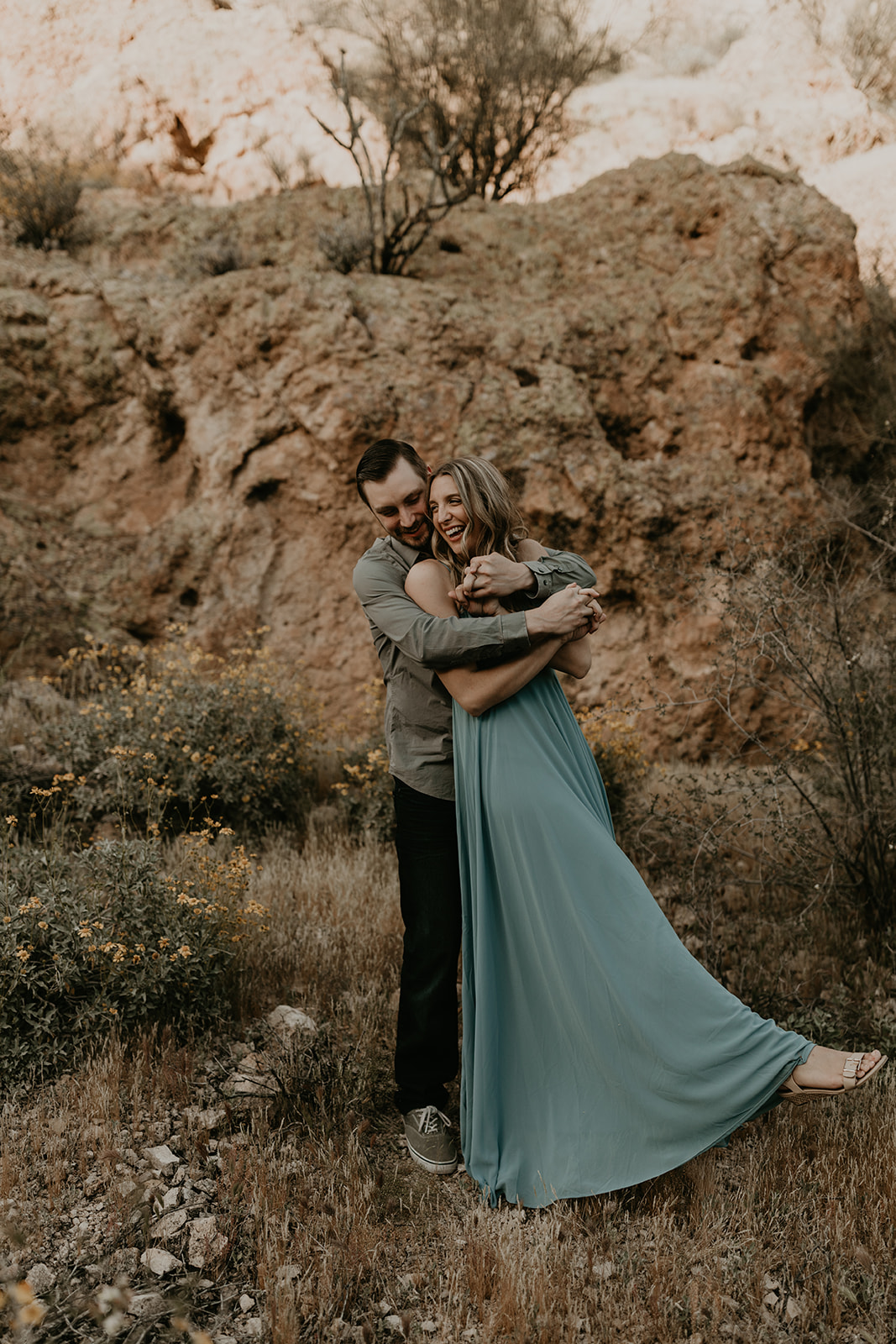 stunning couple pose together in Arizona during their dreamy Canyon Lake engagement photoshoot